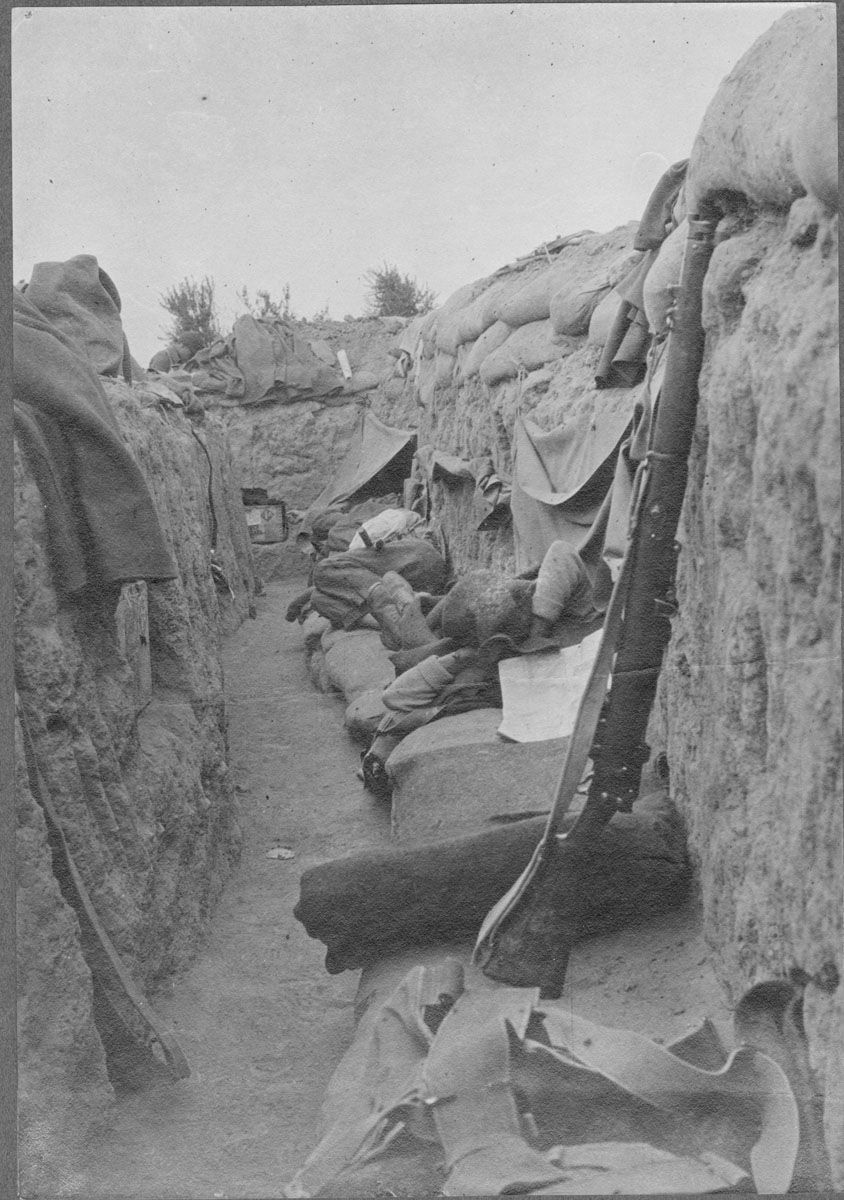 Men sleeping in a frontline trench.